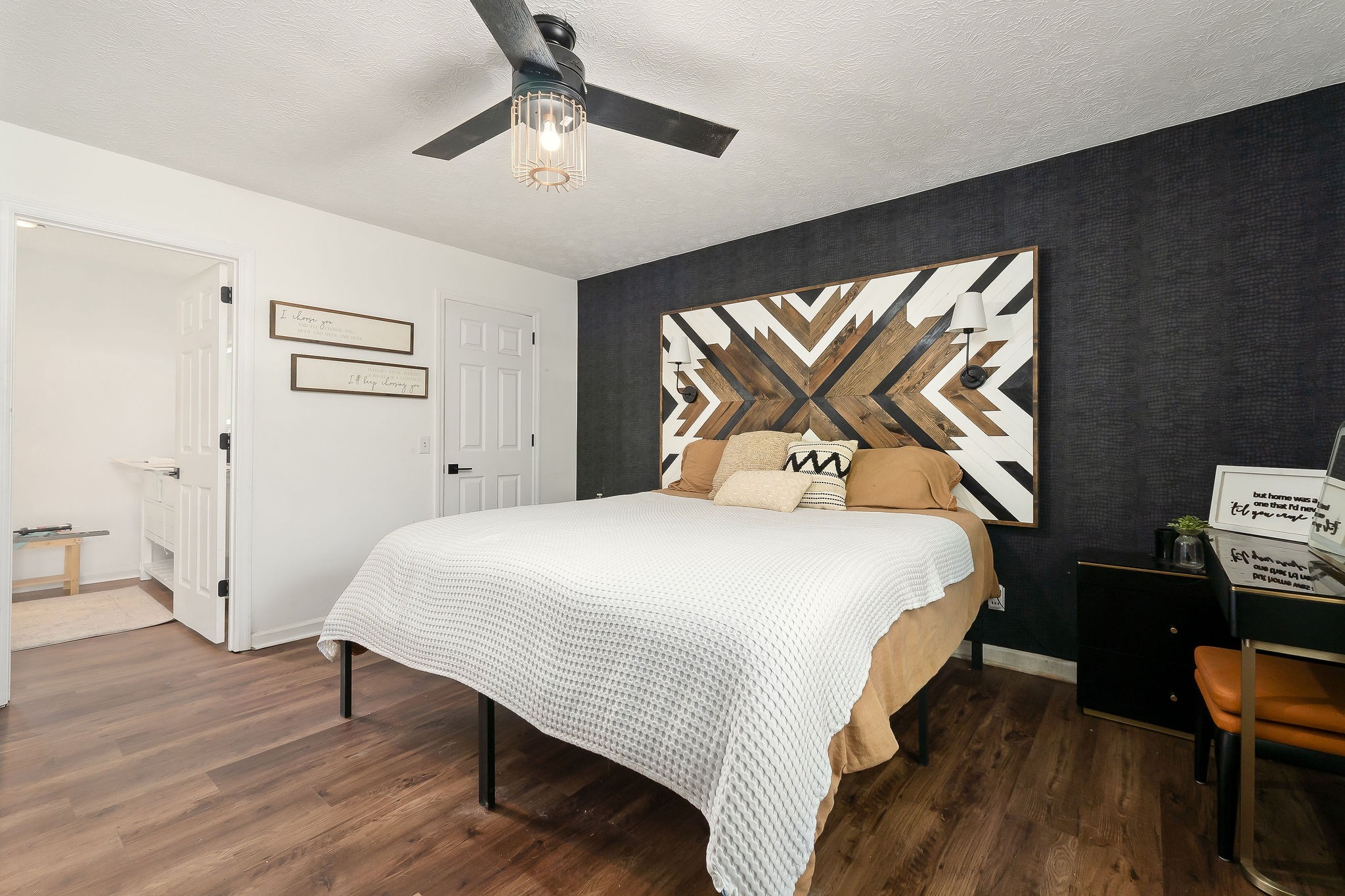 296 Big Rock Road Smithville, TN 37166 - Photo 23 of 32 a bedroom with a bed and a chandelier