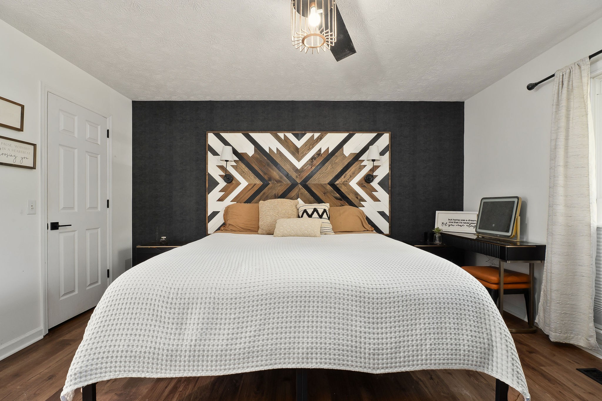 296 Big Rock Road Smithville, TN 37166 - Photo 24 of 32 a bedroom with a bed and a chandelier