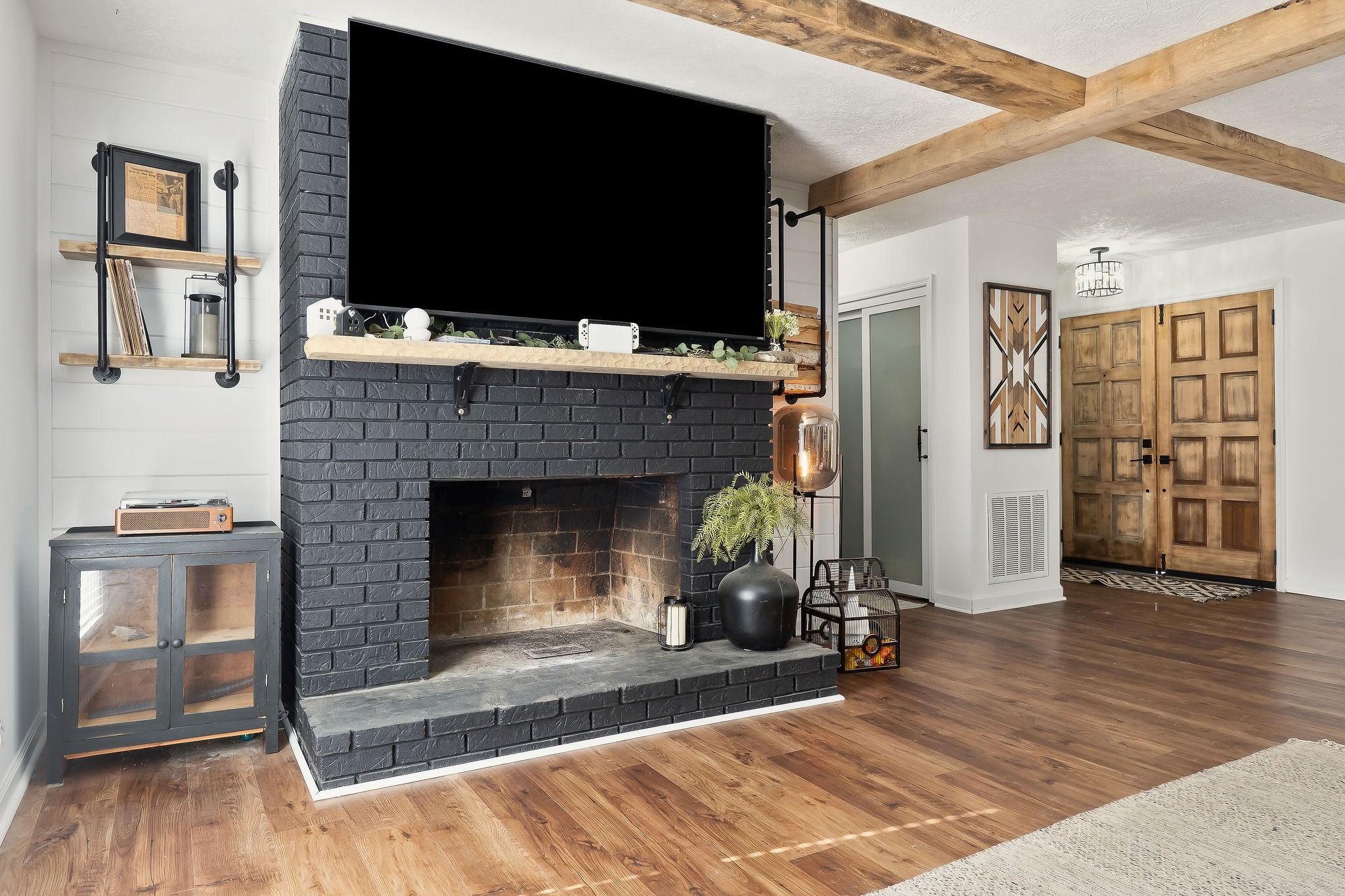 296 Big Rock Road Smithville, TN 37166 - Photo 6 of 32 a living room with a fireplace and a flat screen tv