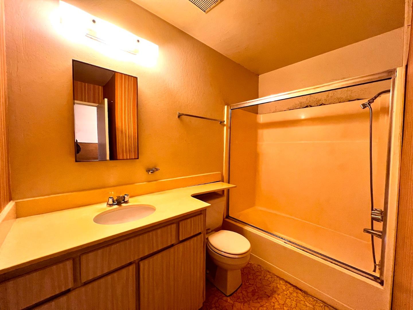 3305 Innerwick Lane San Jose, CA 95121 - Photo 14 of 19 a bathroom with a granite countertop sink toilet and shower