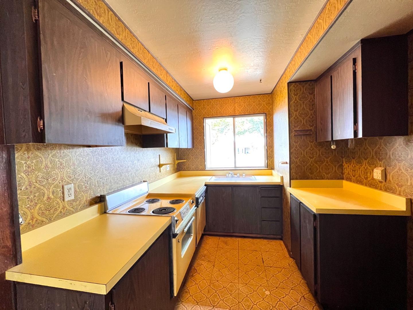 3305 Innerwick Lane San Jose, CA 95121 - Photo 6 of 19 a kitchen with a sink and a stove top oven