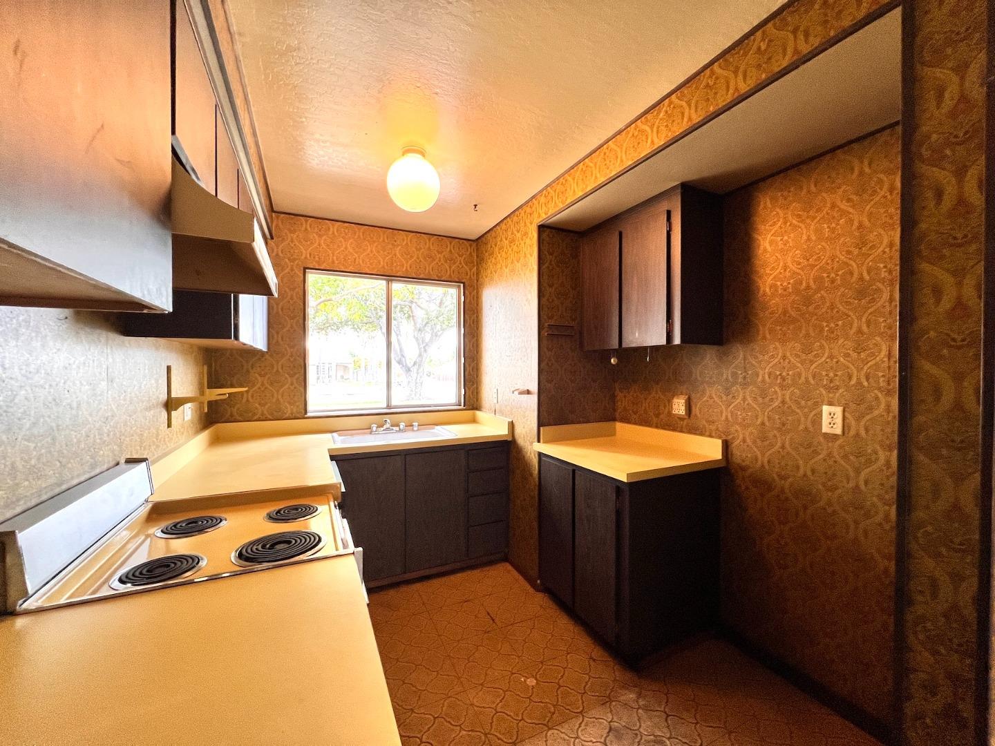 3305 Innerwick Lane San Jose, CA 95121 - Photo 7 of 19 a kitchen that has a sink and a stove