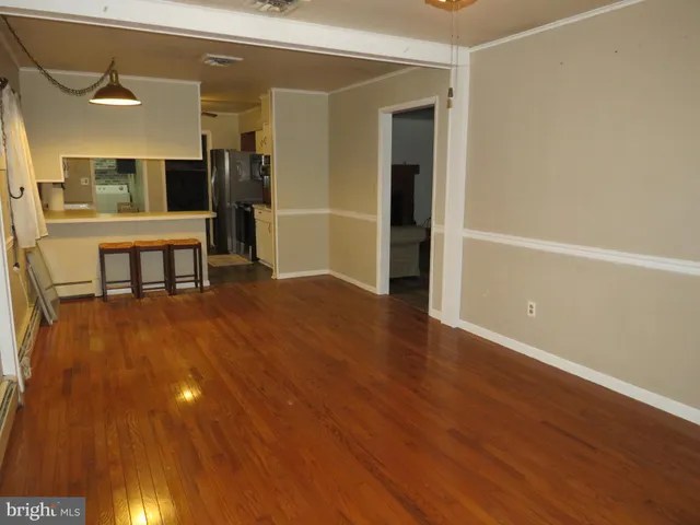 a view of a livingroom with furniture and wooden floor