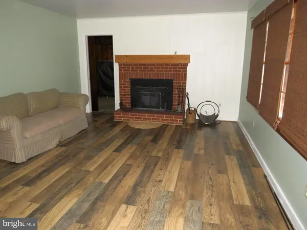 a living room with a couch and a fireplace