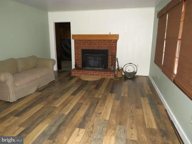 a living room with a couch and a fireplace