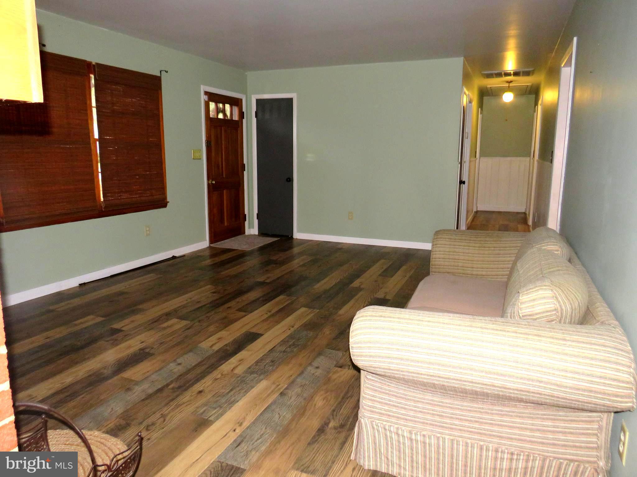 26419 Minden Avenue Crisfield, MD 21817 - Photo 20 of 31 a bedroom with a bed and a dresser