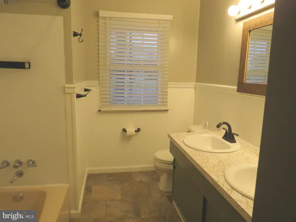 a bathroom with a sink and a tub