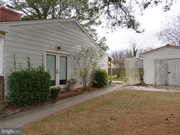 a backyard of a house with yard and garage