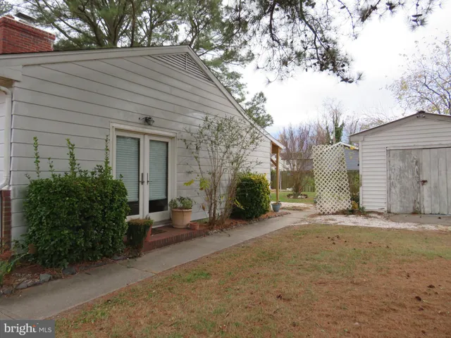 a backyard of a house with yard and garage