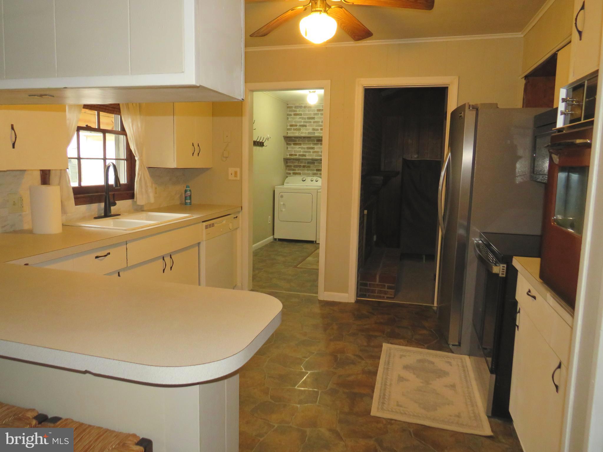 26419 Minden Avenue Crisfield, MD 21817 - Photo 7 of 31 a bathroom with a sink a toilet and shower
