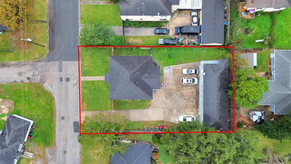 an aerial view of a house with a garden