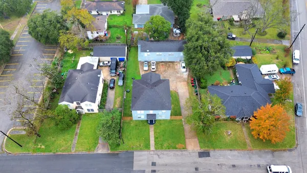 an aerial view of a house with a garden
