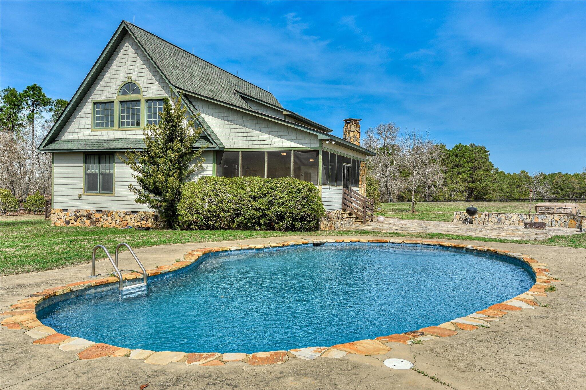 1063 Colbert Bridge Road Aiken, SC 29803 - Photo 1 of 68 a view of a house with swimming pool