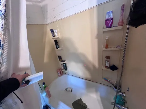 a bathroom with a sink and mirror