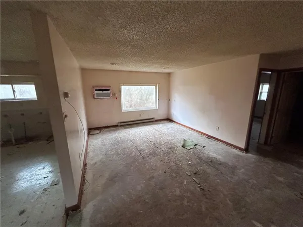 a view of room with stairs and furniture