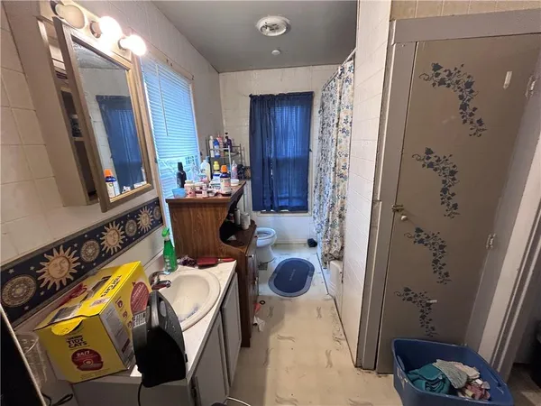 a bathroom with a tub and shower