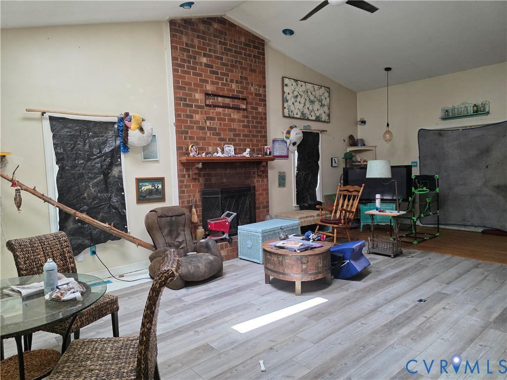 3161 Dorrell Road Aylett, VA 23009 - Photo 4 of 41 a living room with furniture and a fireplace