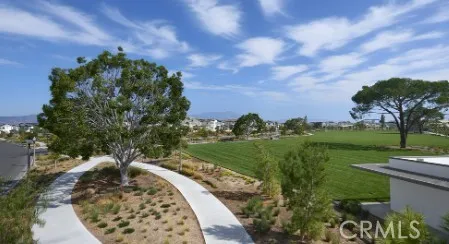 a swimming pool with outdoor seating and lake