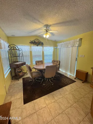 a living room with furniture a rug and a chandelier