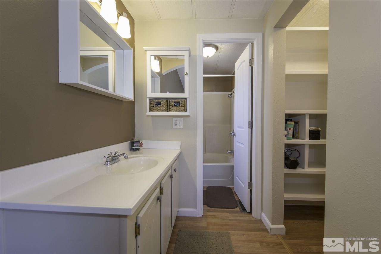 17235 Sunbird Lane Reno, NV 89508 - Photo 13 of 15 a bathroom with a sink and a mirror