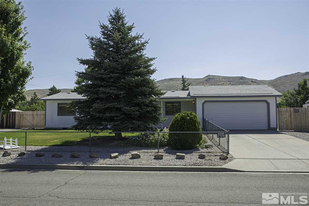 17235 Sunbird Lane Reno, NV 89508 - Photo 2 of 15 a front view of a house with garden