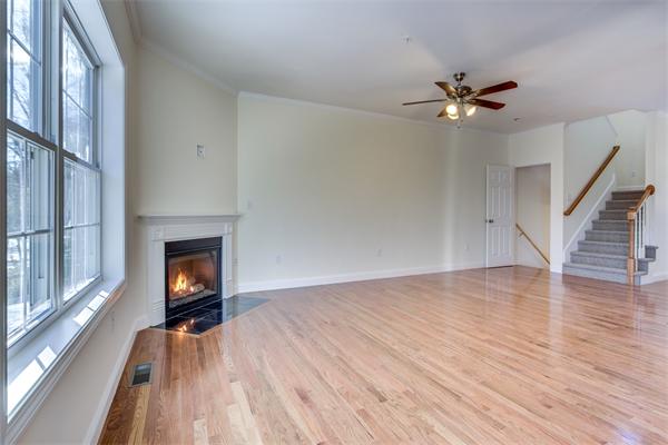 90 Rangeway Road, Unit 203 Billerica, MA 01862 - Photo 18 of 25 a view of empty room with wooden floor and fan