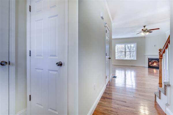 90 Rangeway Road, Unit 203 Billerica, MA 01862 - Photo 4 of 25 a view of a hallway with wooden floor and windows