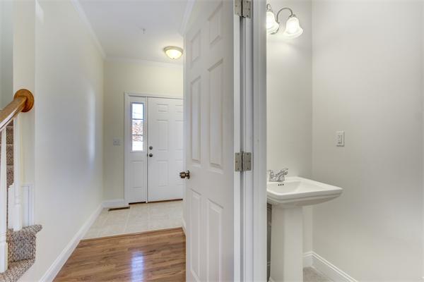 90 Rangeway Road, Unit 203 Billerica, MA 01862 - Photo 7 of 25 a bathroom with a sink and mirror