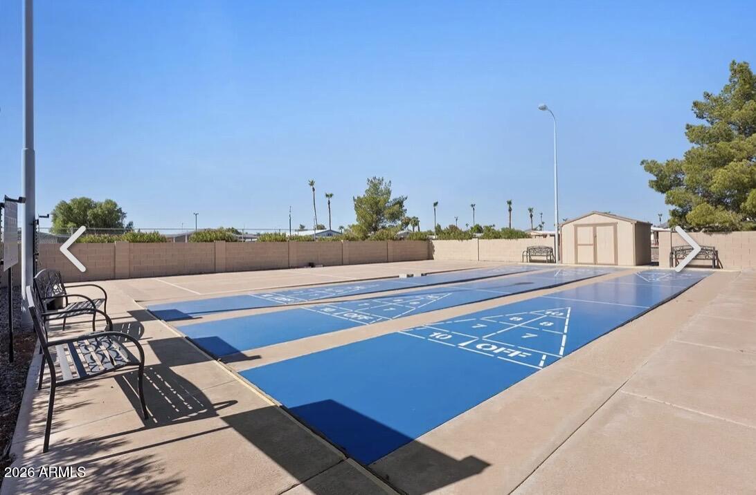 834 South Meridian Road, Unit 104 Apache Junction, AZ 85120 - Photo 43 of 46 a terrace with outdoor seating and city view