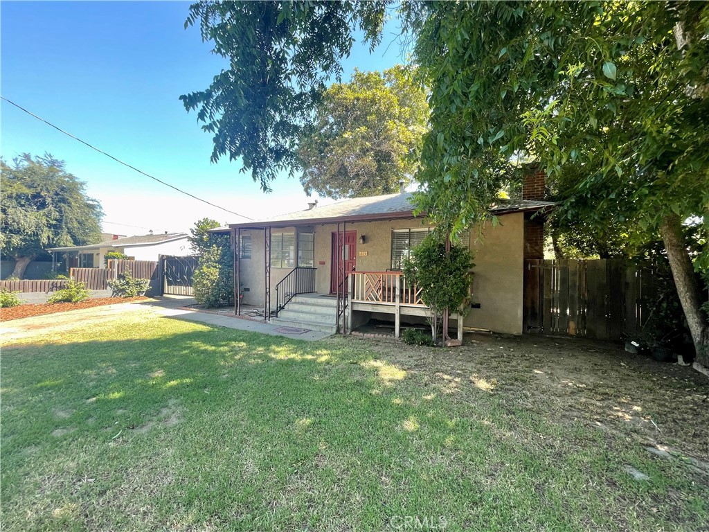 536 Cypress Avenue Pasadena, CA 91103 - Photo 2 of 14 a view of a house with a patio and a yard