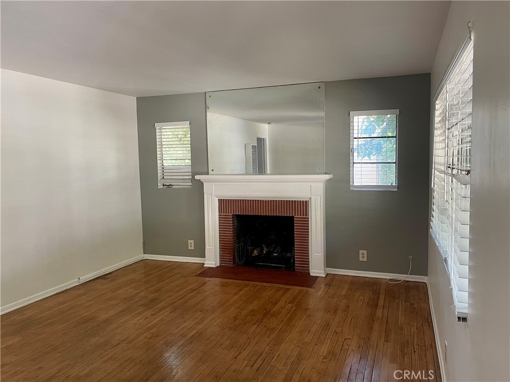 536 Cypress Avenue Pasadena, CA 91103 - Photo 3 of 14 a view of an empty room with wooden floor and a window