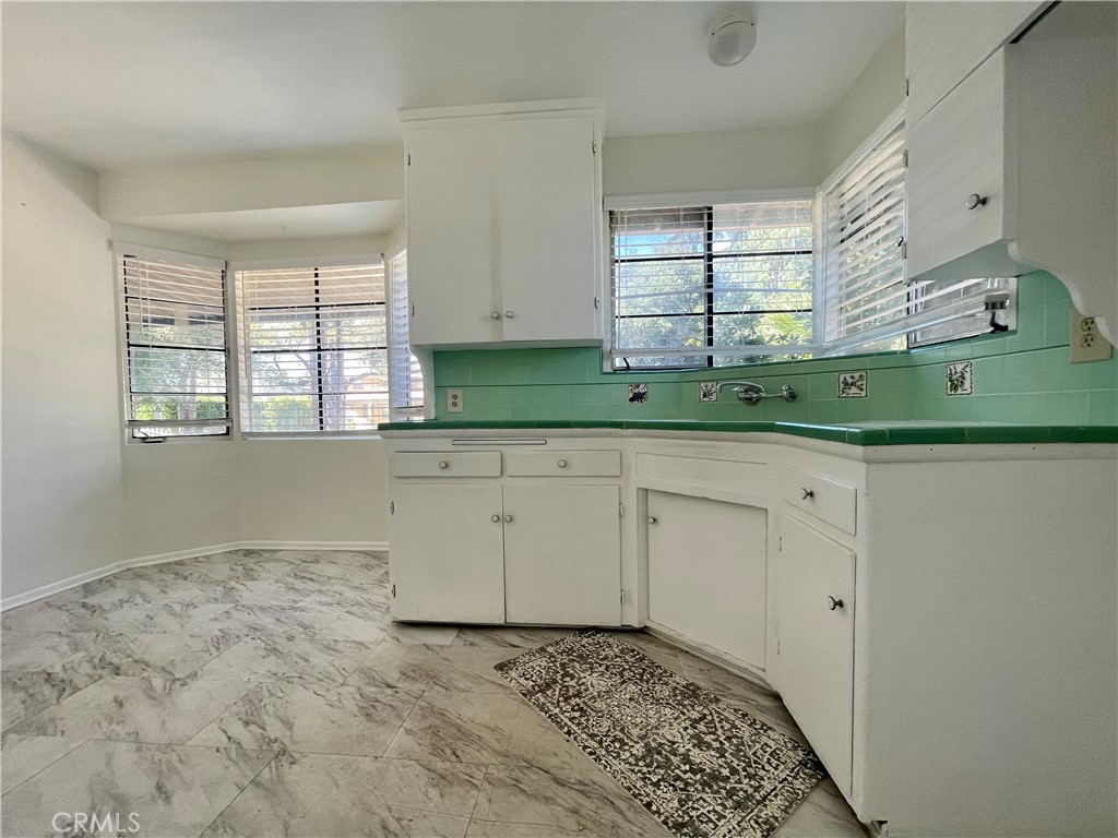 536 Cypress Avenue Pasadena, CA 91103 - Photo 4 of 14 a view of a kitchen with a sink window and cabinets