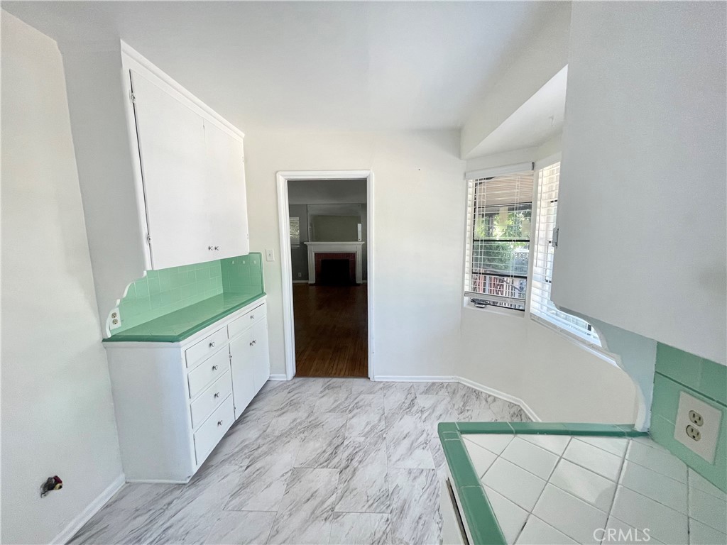 536 Cypress Avenue Pasadena, CA 91103 - Photo 6 of 14 a kitchen with granite countertop a refrigerator and a sink