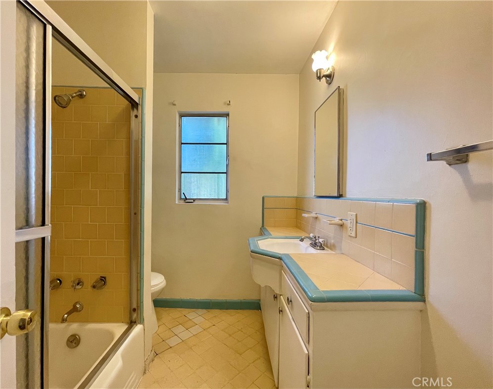 536 Cypress Avenue Pasadena, CA 91103 - Photo 8 of 14 a bathroom with a sink and a mirror