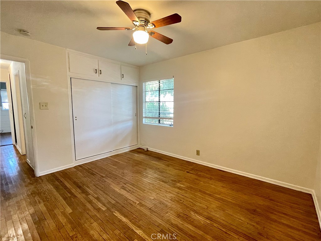 536 Cypress Avenue Pasadena, CA 91103 - Photo 9 of 14 a view of an empty room with wooden floor and a window