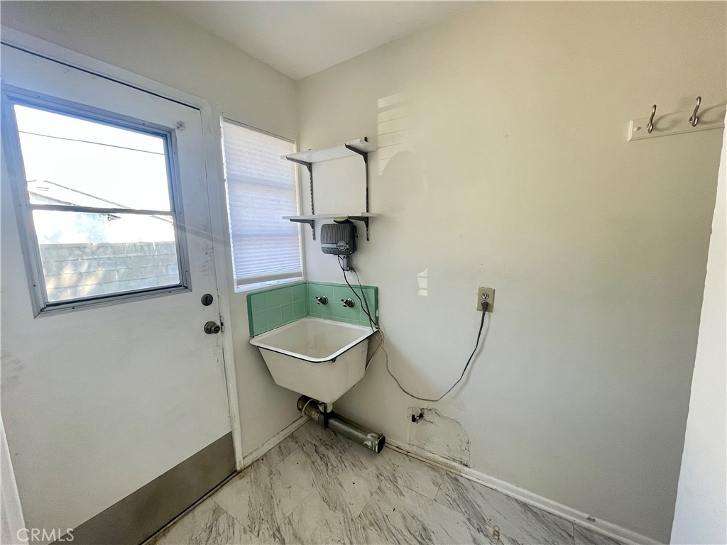 536 Cypress Avenue Pasadena, CA 91103 - Photo 10 of 14 a bathroom with a toilet a sink and a window