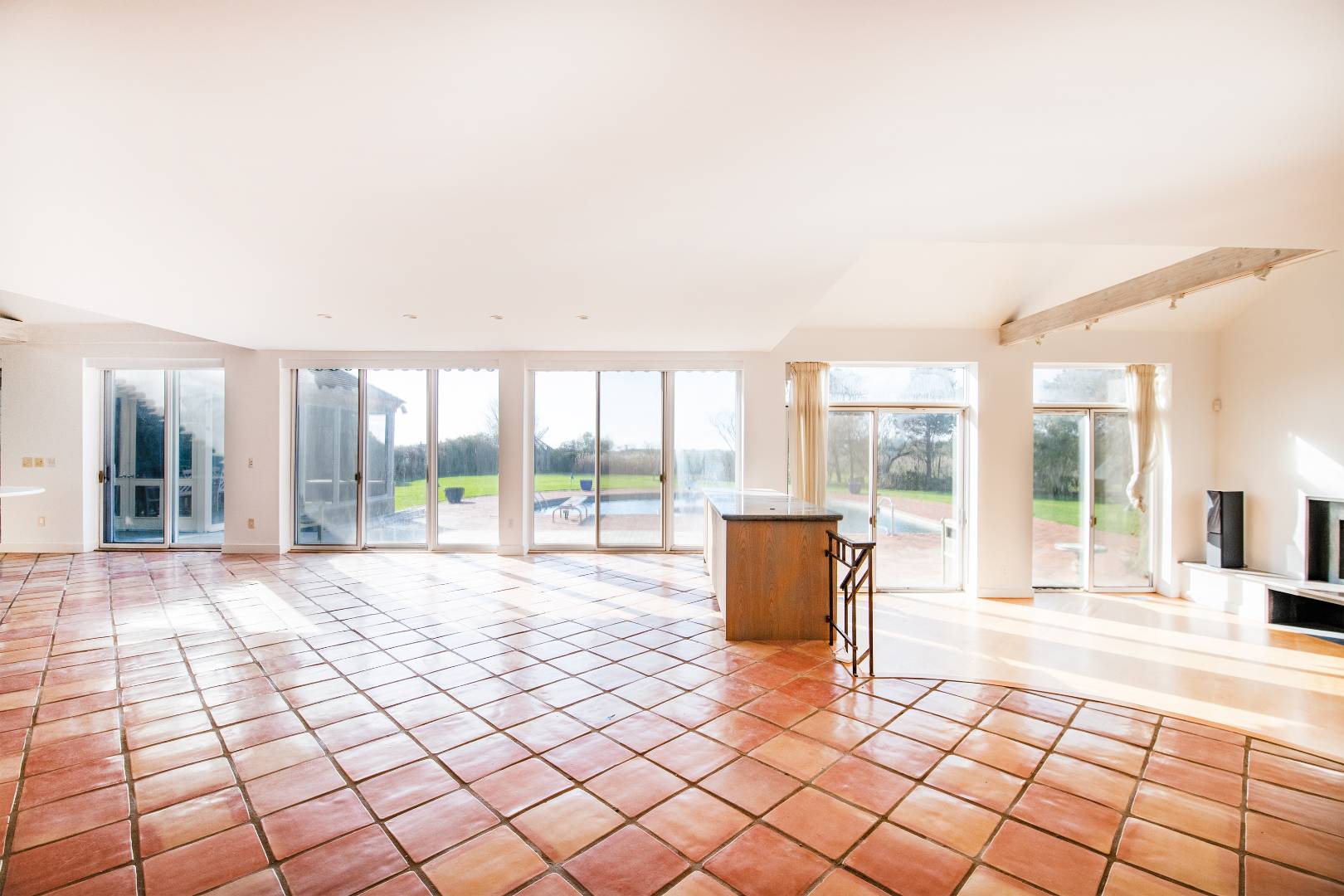 677 Mecox Road Water Mill, NY 11976 - Photo 18 of 24 a spacious bedroom with a large window and a table