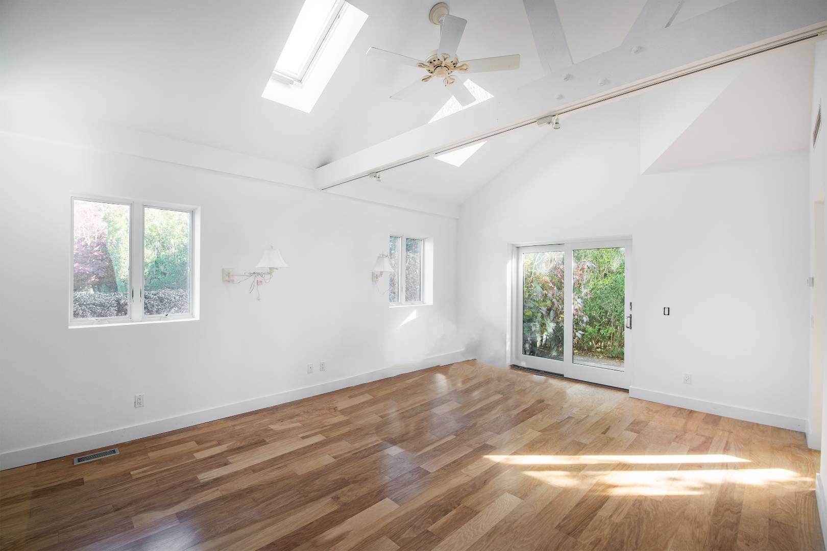 677 Mecox Road Water Mill, NY 11976 - Photo 21 of 24 a view of empty room with wooden floor and fan