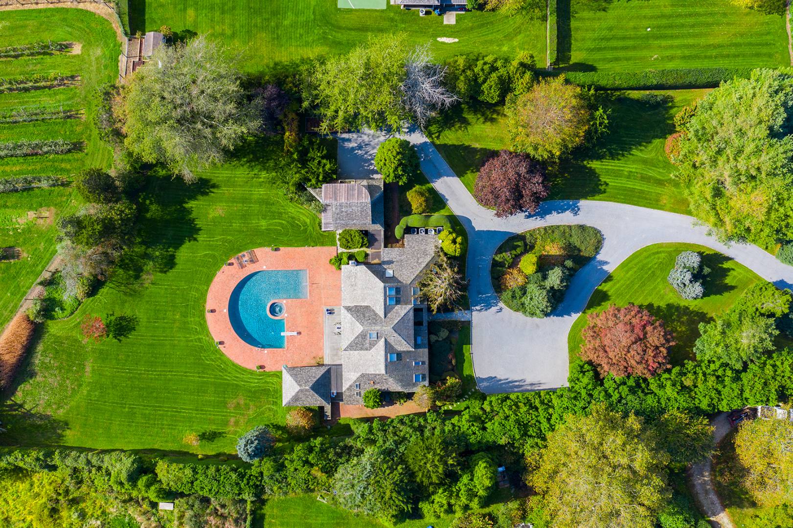 677 Mecox Road Water Mill, NY 11976 - Photo 7 of 24 an aerial view of a house with outdoor space pool seating area and yard