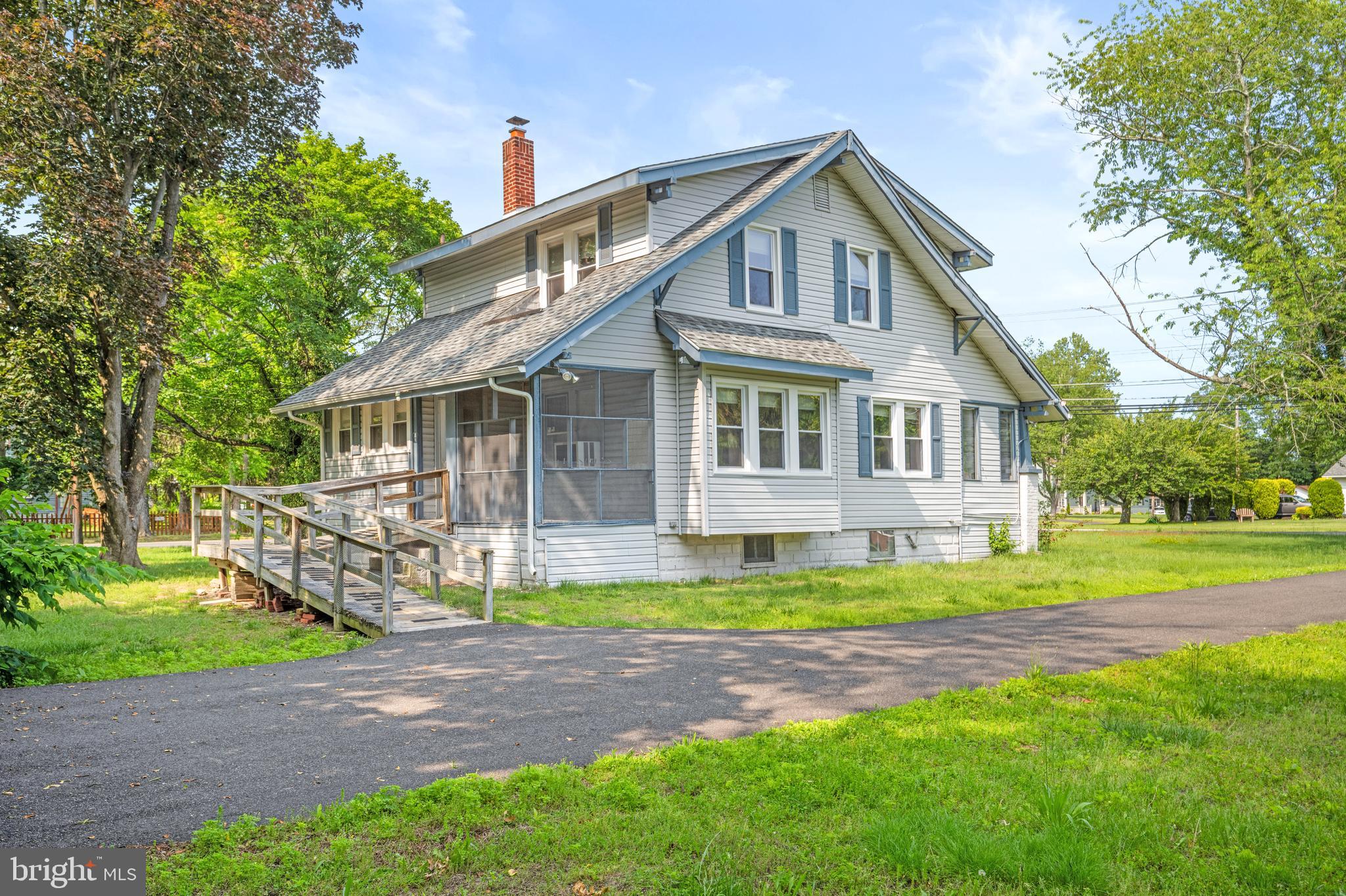 668 South Spring Road Vineland, NJ 08361 - Photo 4 of 24 a front view of a house with a garden and yard