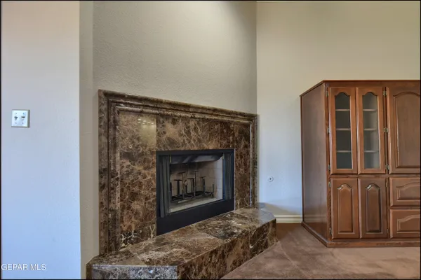 a kitchen with furniture a counter top space a sink and stainless steel appliances