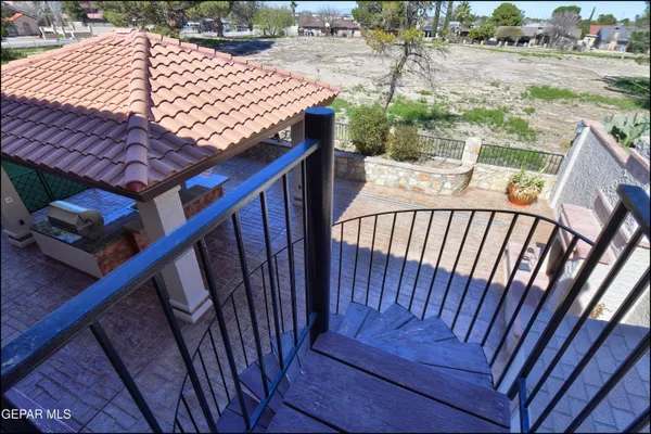 an aerial view of a houses with a yard