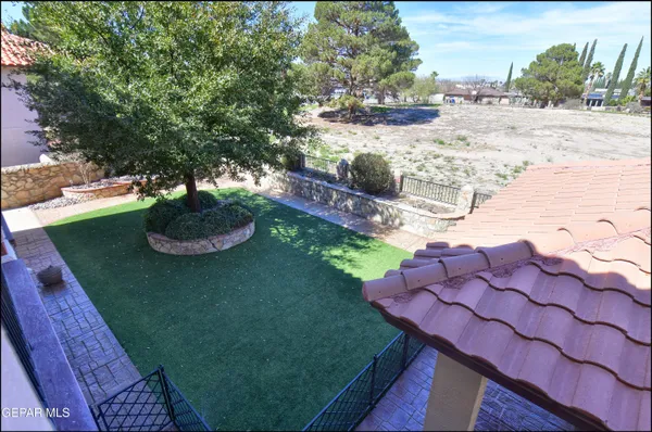 an aerial view of a house with a swimming pool yard and outdoor seating