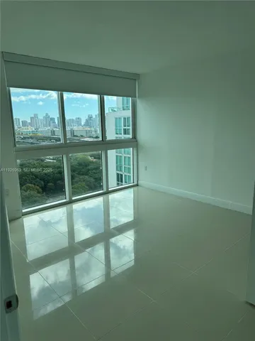 a view of a room with a large window