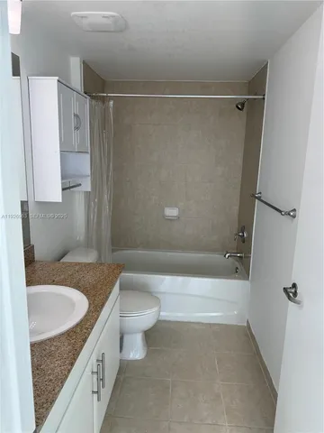 a bathroom with a sink a toilet and a tub