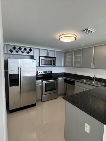 a bathroom with a shower and a toilet