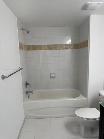 a bathroom with a sink a toilet and a bathtub