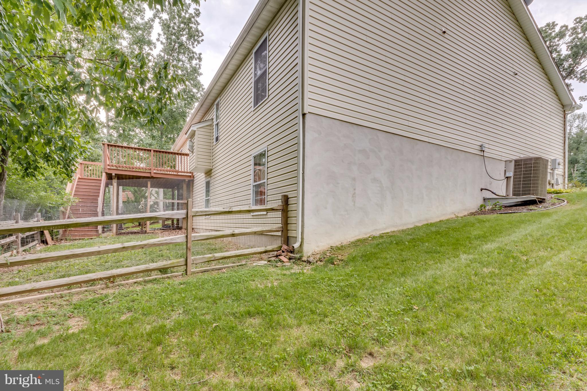 130 Raft Court Inwood, WV 25428 - Photo 2 of 24 a view of house with backyard and garden
