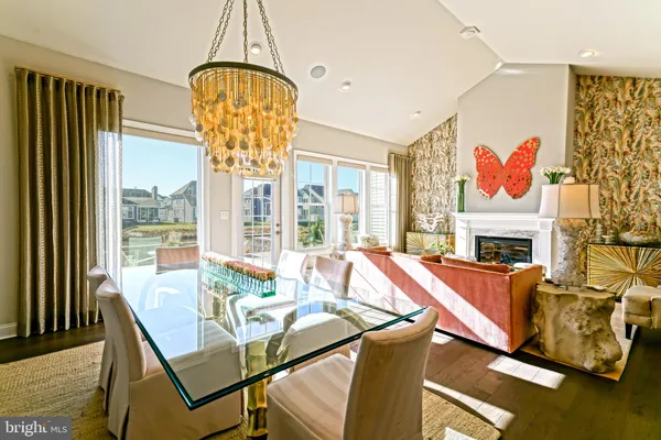 a living room with lots of furniture and a large window