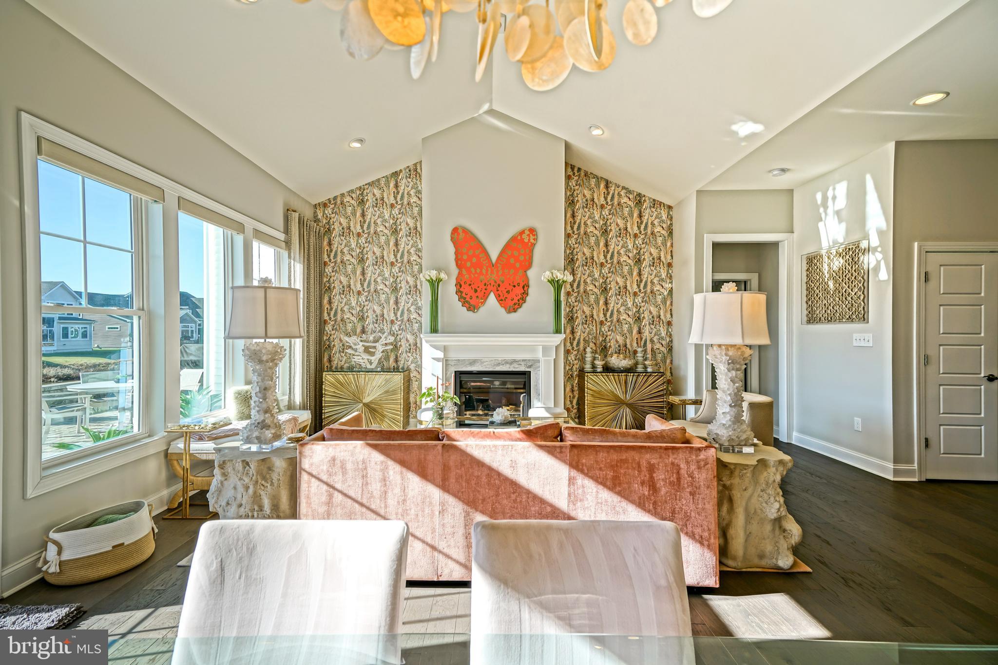 11078 Marvil Road Lewes, DE 19958 - Photo 16 of 98 a living room with fireplace furniture and a large window